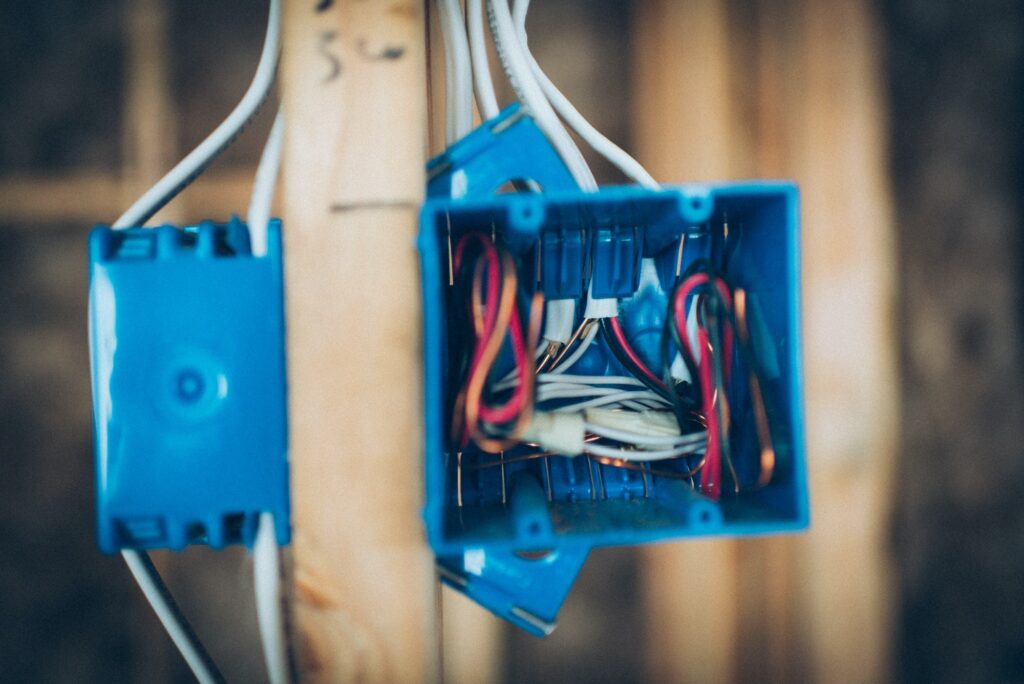 Blue electrical box with exposed wires